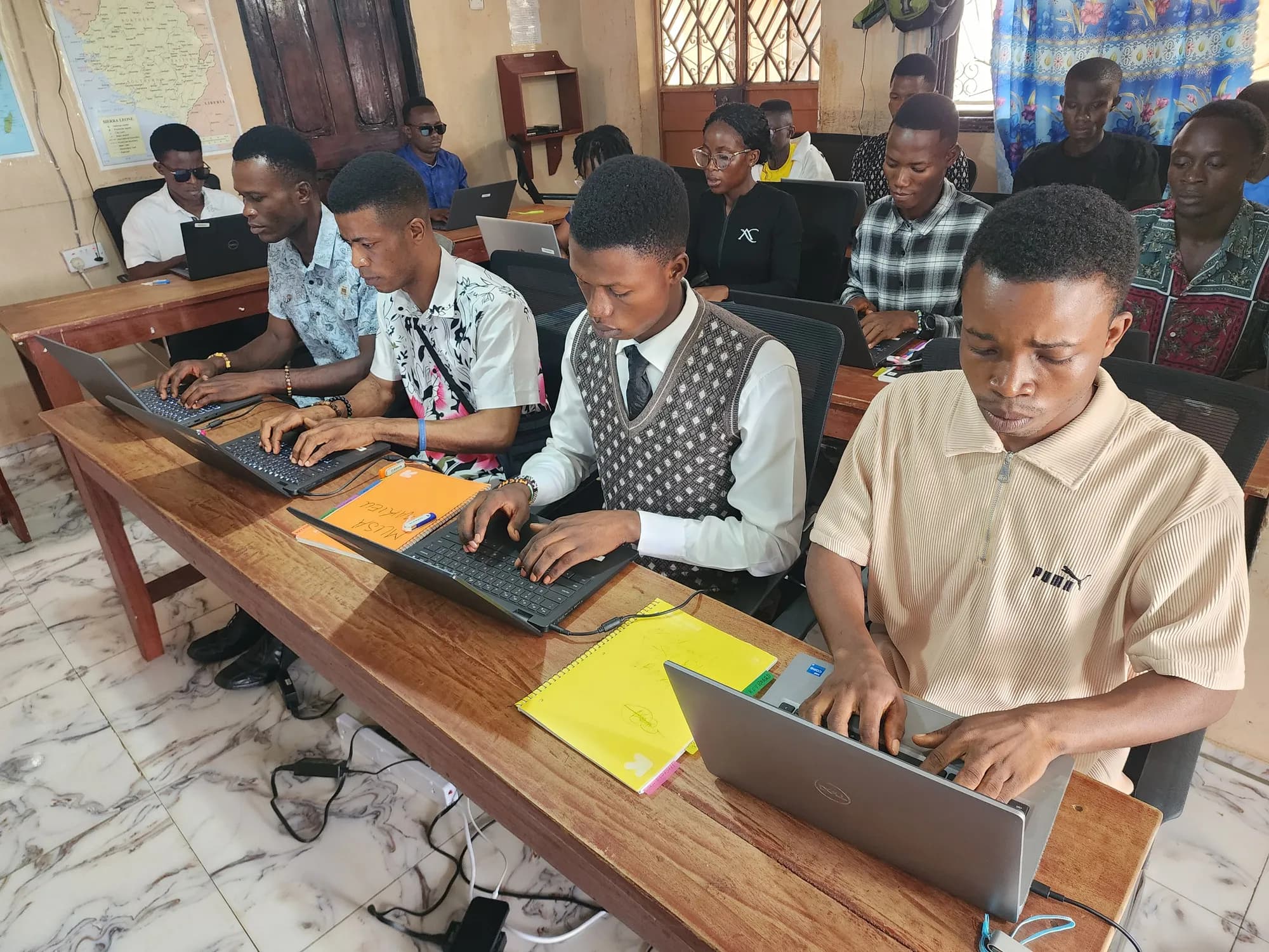 Moriba students working on laptops in the computer lab